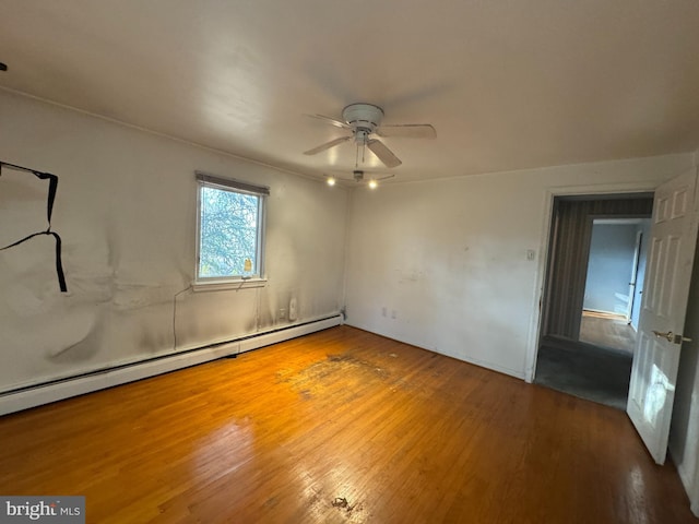 unfurnished room featuring ceiling fan, a baseboard radiator, and hardwood / wood-style flooring