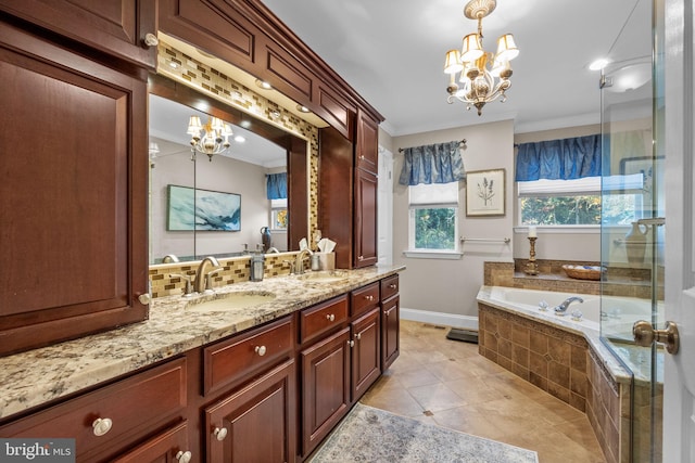 bathroom featuring vanity, tile patterned floors, ornamental molding, tiled tub, and a notable chandelier