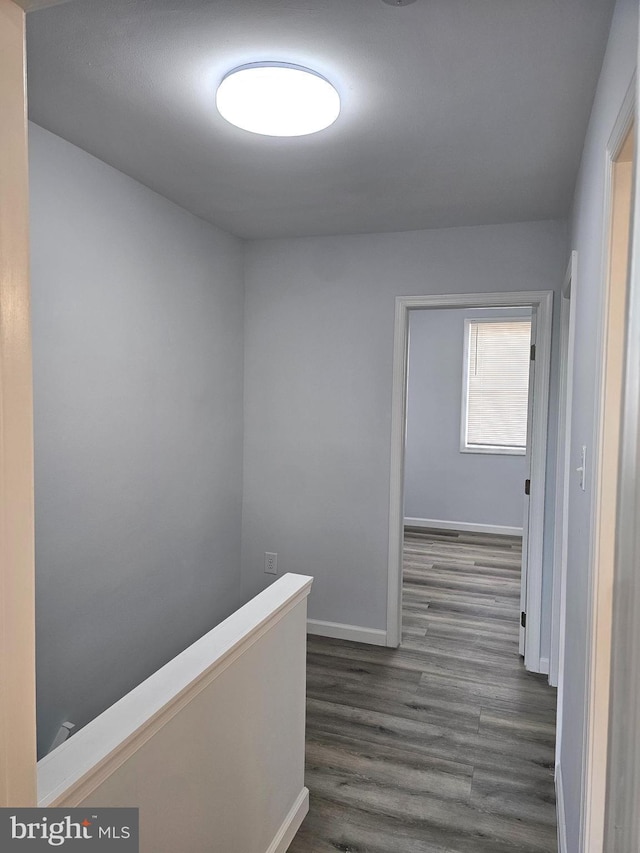 corridor with dark wood-type flooring