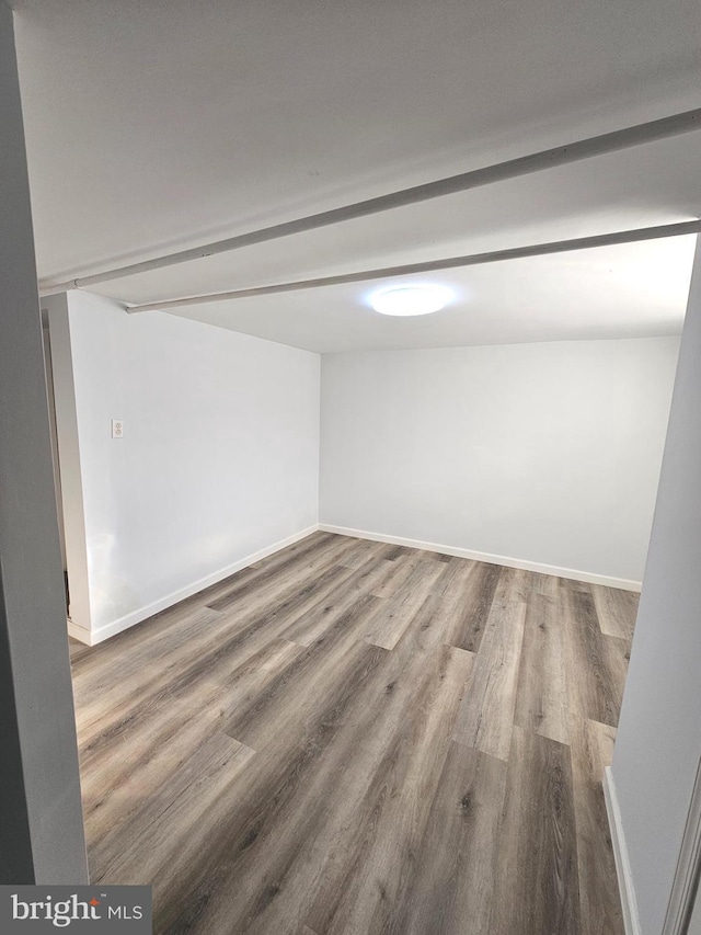 spare room featuring hardwood / wood-style floors