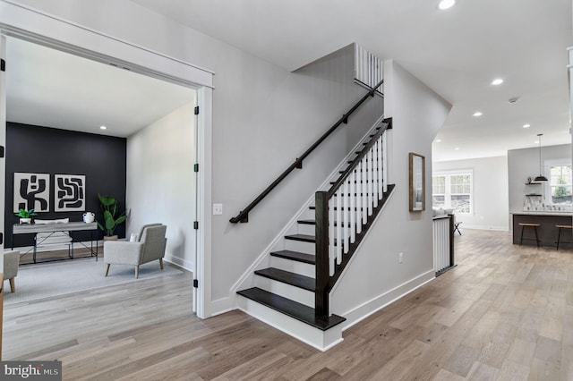 stairs with wood-type flooring