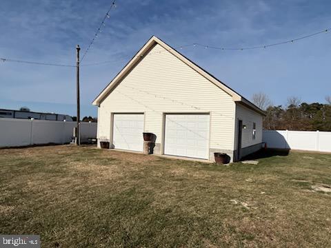 garage featuring a yard