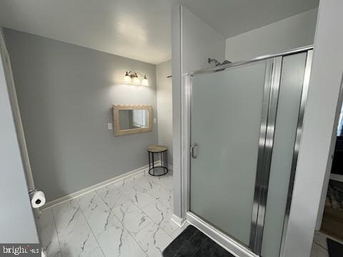 bathroom with an enclosed shower