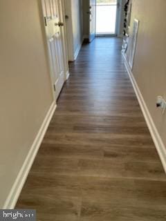 hallway featuring dark hardwood / wood-style floors