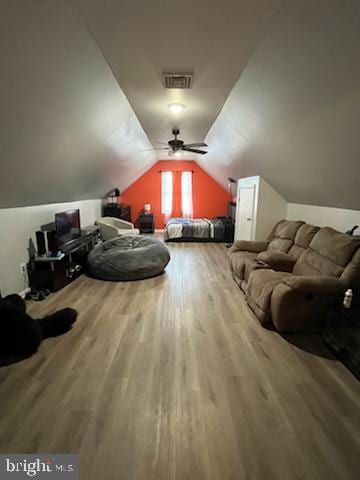 additional living space with ceiling fan, vaulted ceiling, and hardwood / wood-style flooring