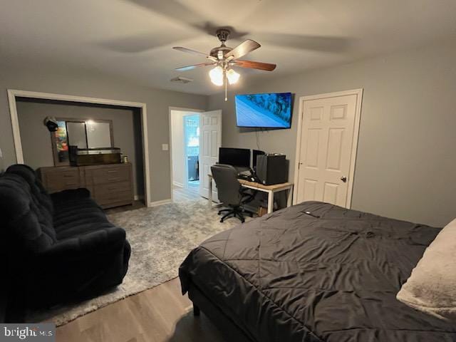 carpeted bedroom featuring ceiling fan