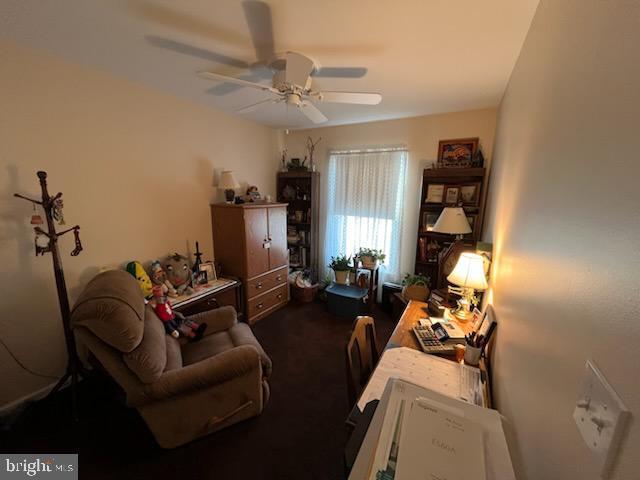 interior space featuring ceiling fan