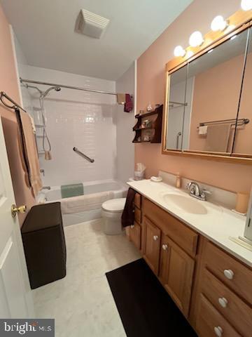 full bathroom featuring vanity, toilet, and shower / bathtub combination