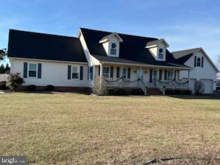 view of front of home with a front lawn and a porch