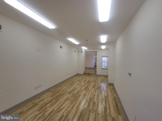 spare room with light hardwood / wood-style flooring