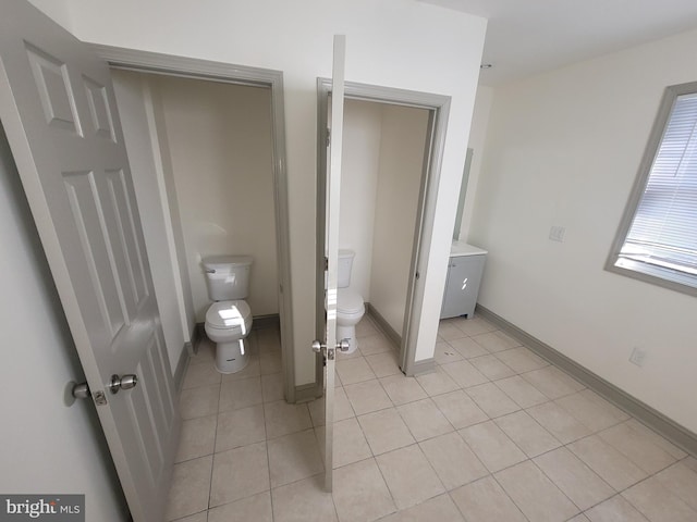 bathroom with tile patterned flooring and toilet