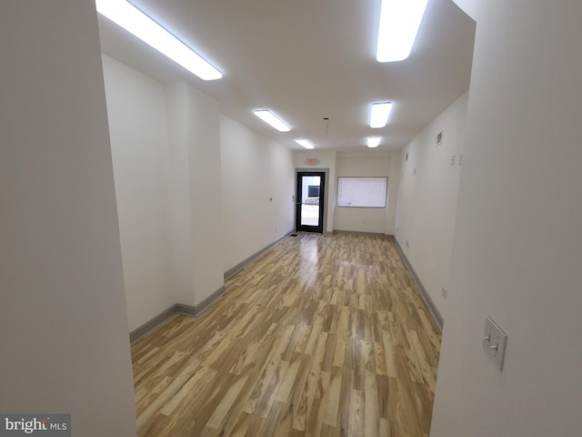 unfurnished room with light hardwood / wood-style flooring