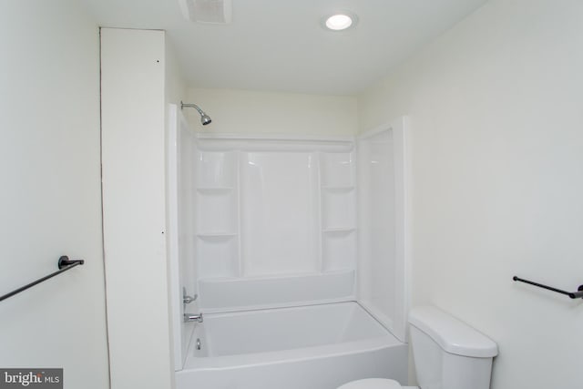 bathroom featuring shower / bath combination and toilet