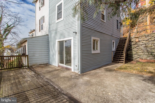 view of side of home featuring a patio area