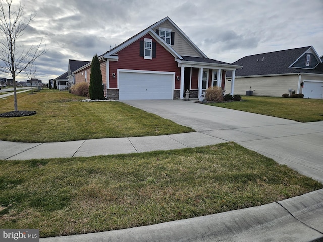 view of front of home featuring a garage and a front lawn