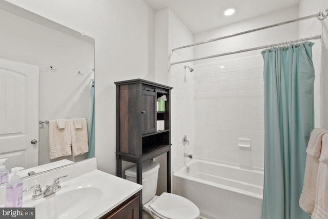 full bathroom featuring vanity, toilet, and shower / tub combo with curtain