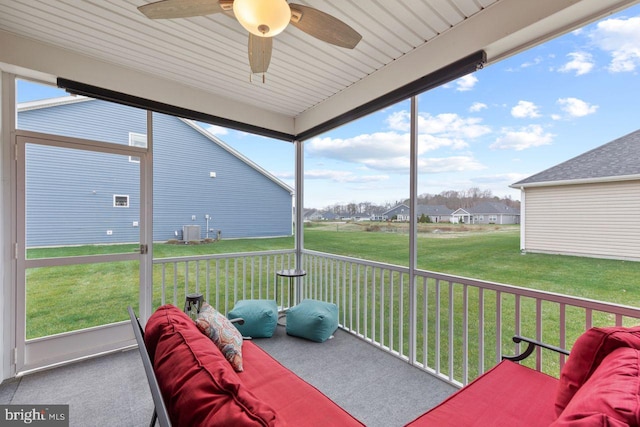 sunroom with ceiling fan and a healthy amount of sunlight