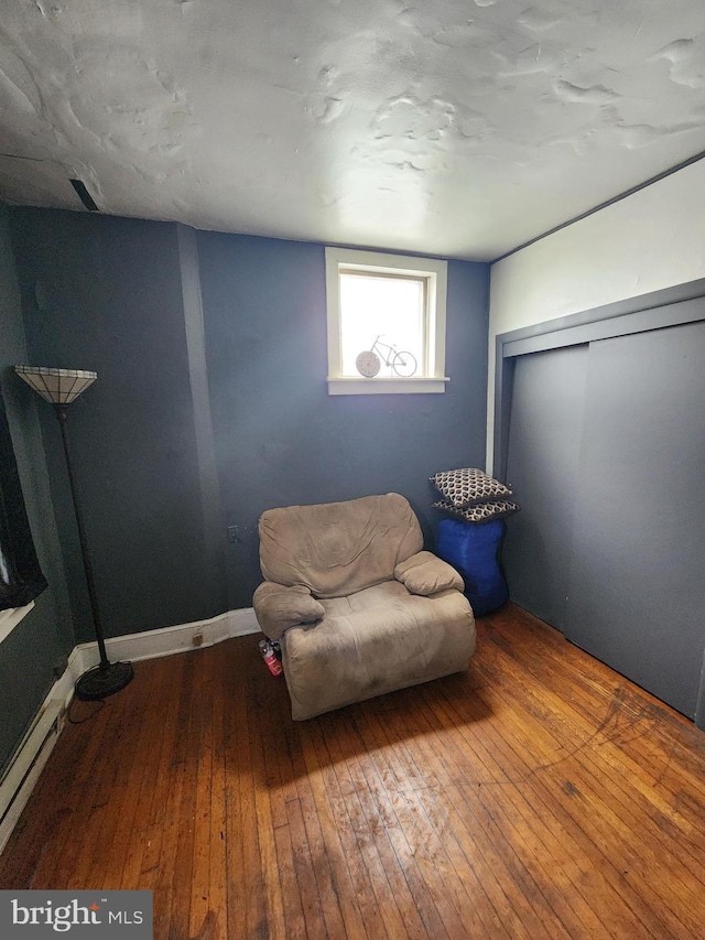 unfurnished room with wood-type flooring