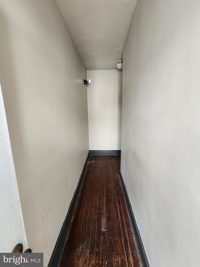 hallway featuring hardwood / wood-style flooring