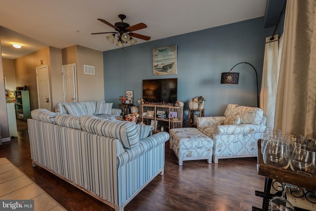 living room with dark hardwood / wood-style floors and ceiling fan