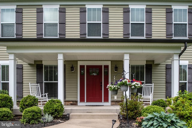 property entrance featuring a porch