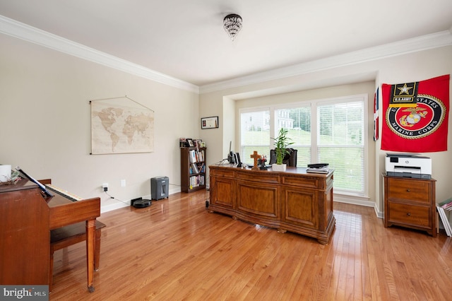 office area with ornamental molding and light hardwood / wood-style flooring