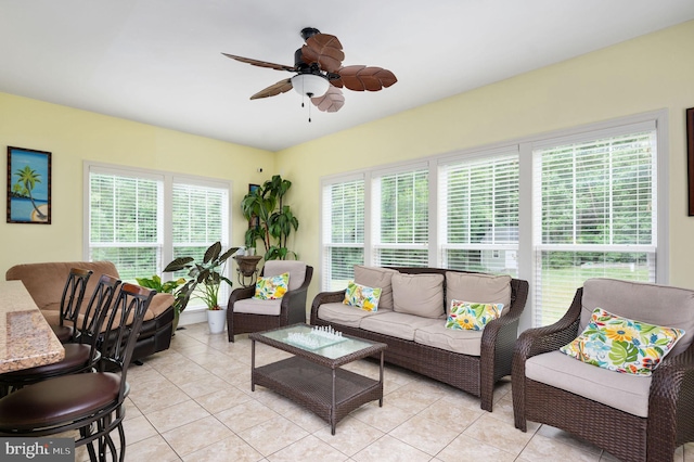 living room with light tile patterned floors and ceiling fan