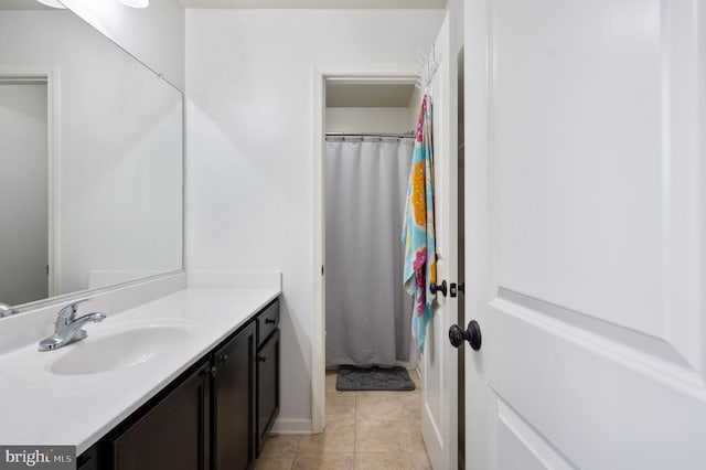 bathroom with tile patterned floors and vanity