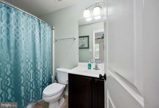 bathroom with tile patterned floors, vanity, toilet, and a shower with curtain