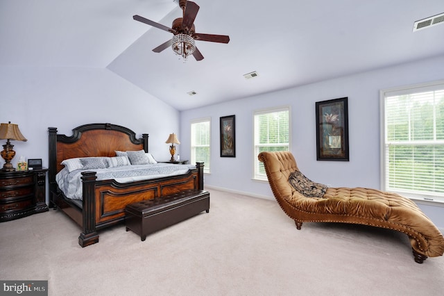 carpeted bedroom featuring vaulted ceiling and ceiling fan