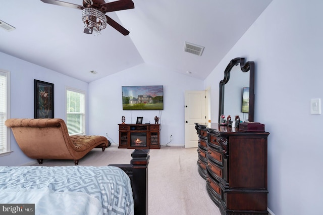 carpeted bedroom featuring ceiling fan and lofted ceiling