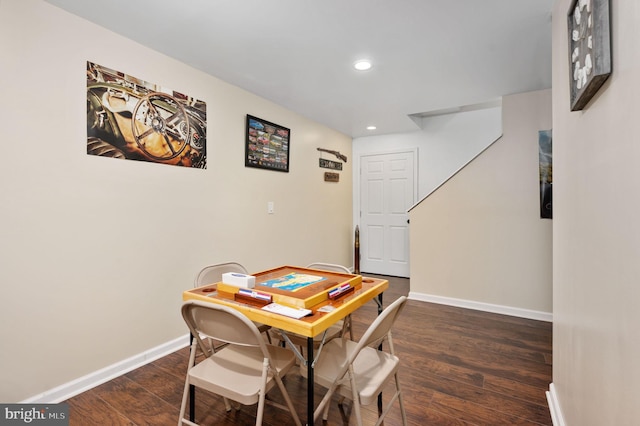 dining space featuring dark hardwood / wood-style floors