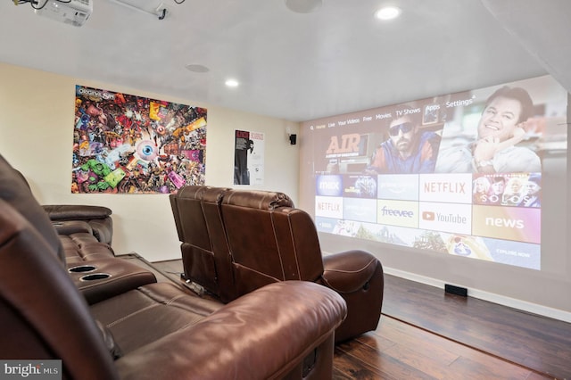 cinema featuring hardwood / wood-style flooring