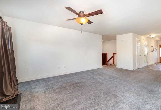 unfurnished room featuring carpet and ceiling fan