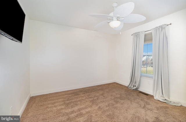 carpeted empty room with ceiling fan