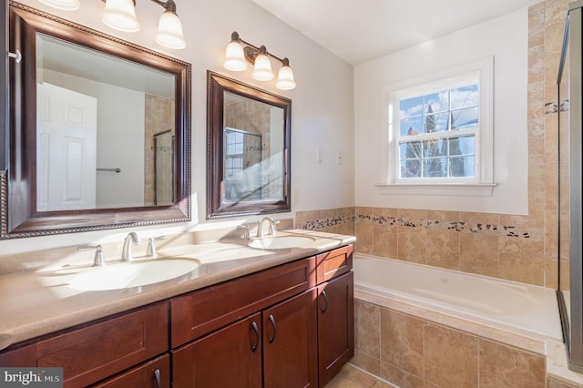 bathroom featuring vanity and separate shower and tub