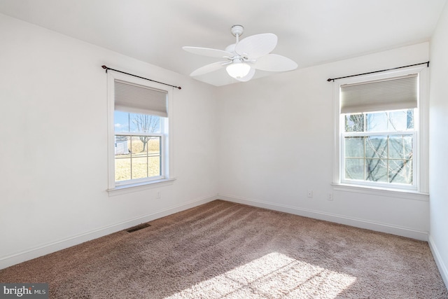 unfurnished room featuring carpet floors and ceiling fan