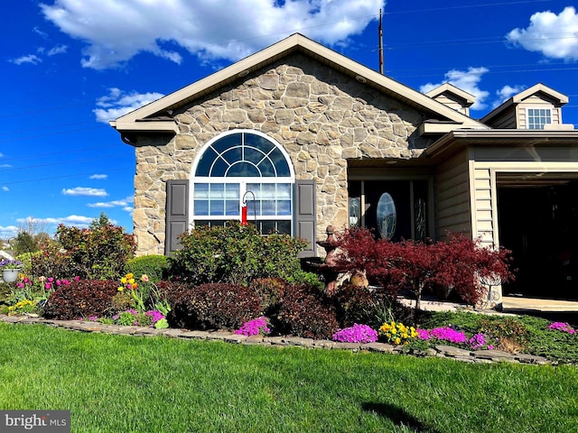 property entrance with a yard