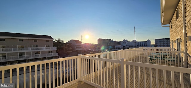 view of balcony at dusk