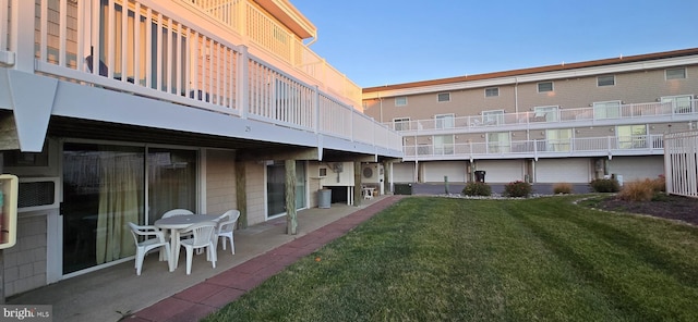 exterior space featuring a lawn and a patio area