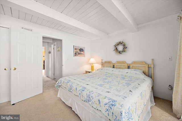 bedroom featuring beam ceiling and light carpet