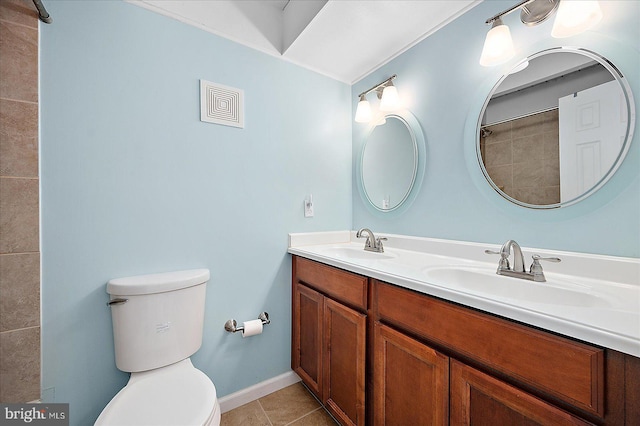 bathroom with tile patterned floors, vanity, and toilet