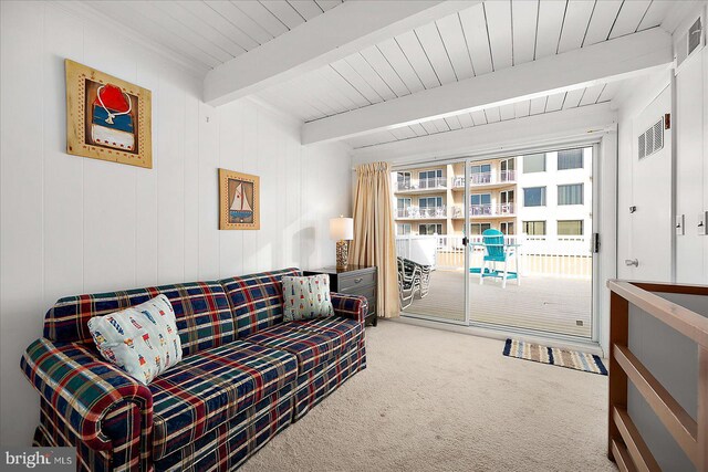 living room with beamed ceiling, wood ceiling, and carpet