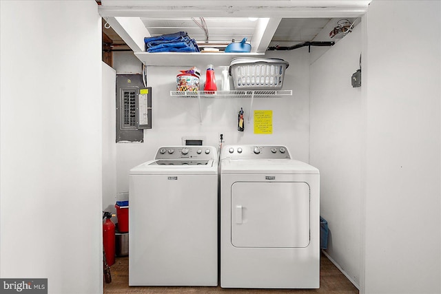 clothes washing area with separate washer and dryer