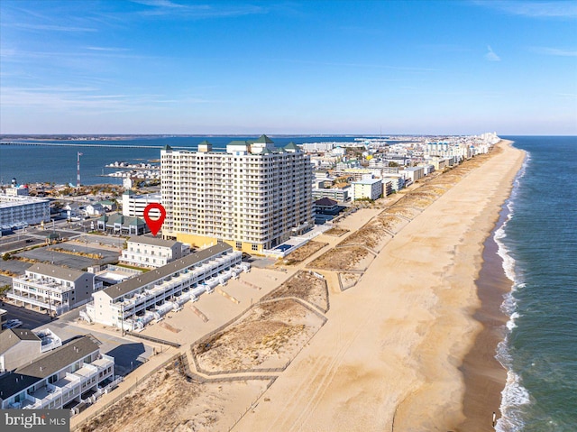 bird's eye view with a water view and a view of the beach