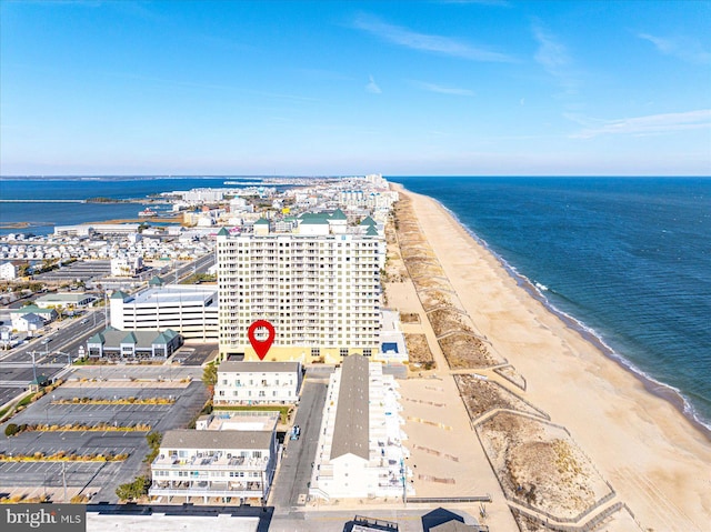 birds eye view of property with a beach view and a water view