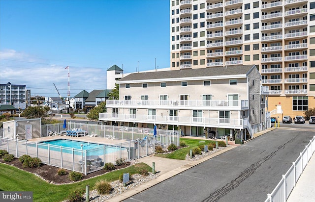 view of property featuring a community pool