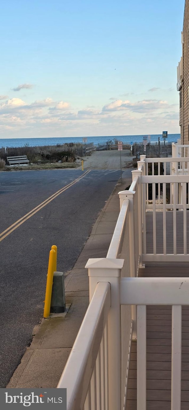 balcony featuring a water view