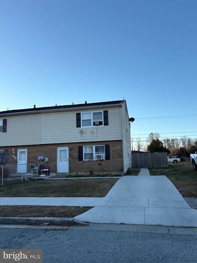 view of front of home featuring cooling unit and a patio