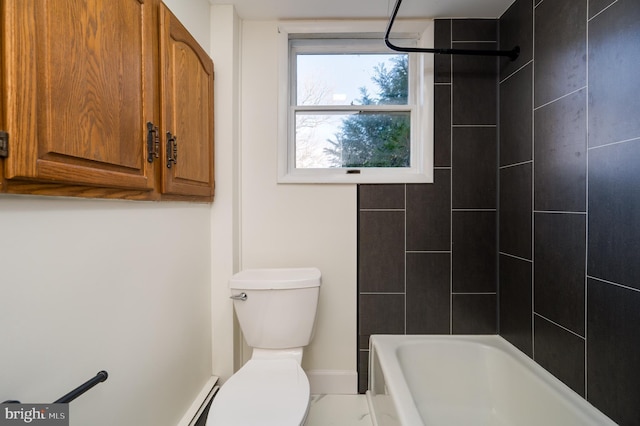 bathroom featuring tiled shower / bath combo and toilet